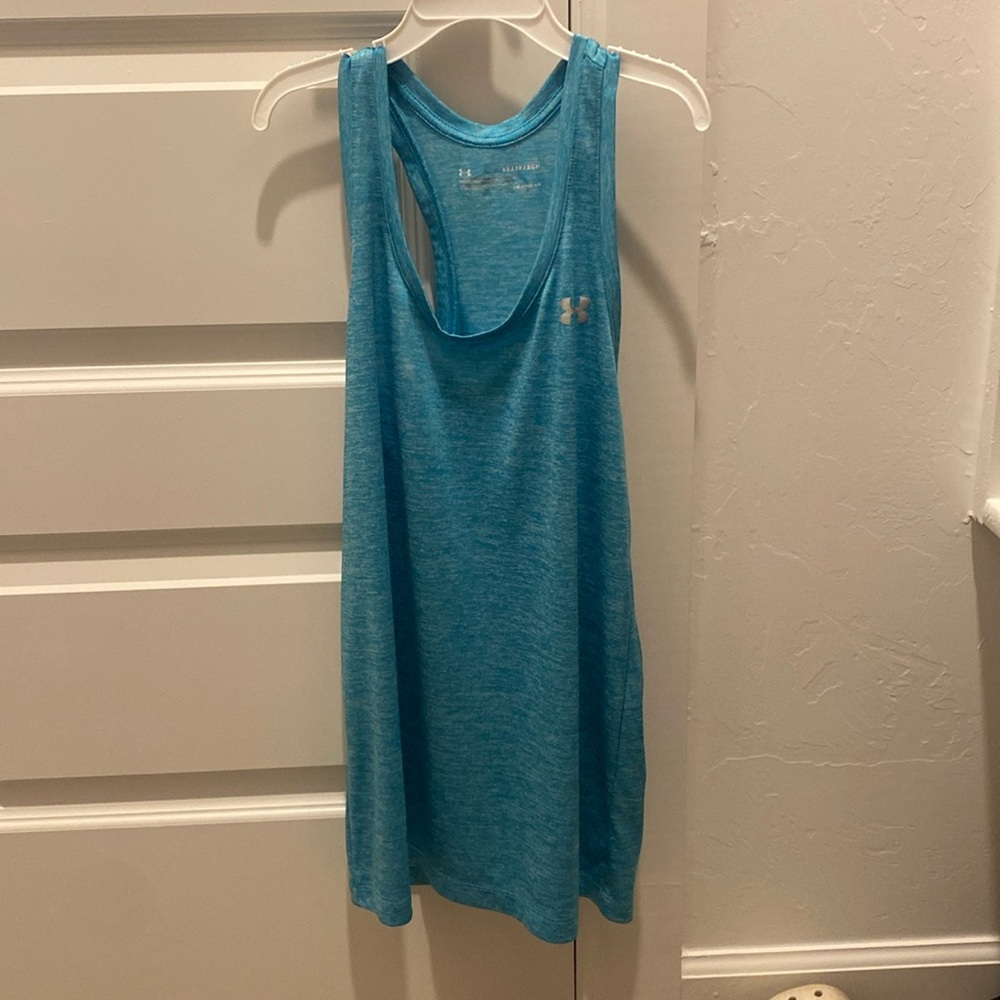 Under Armour electric blue tank top. Razorback and very breathable. Women’s XS